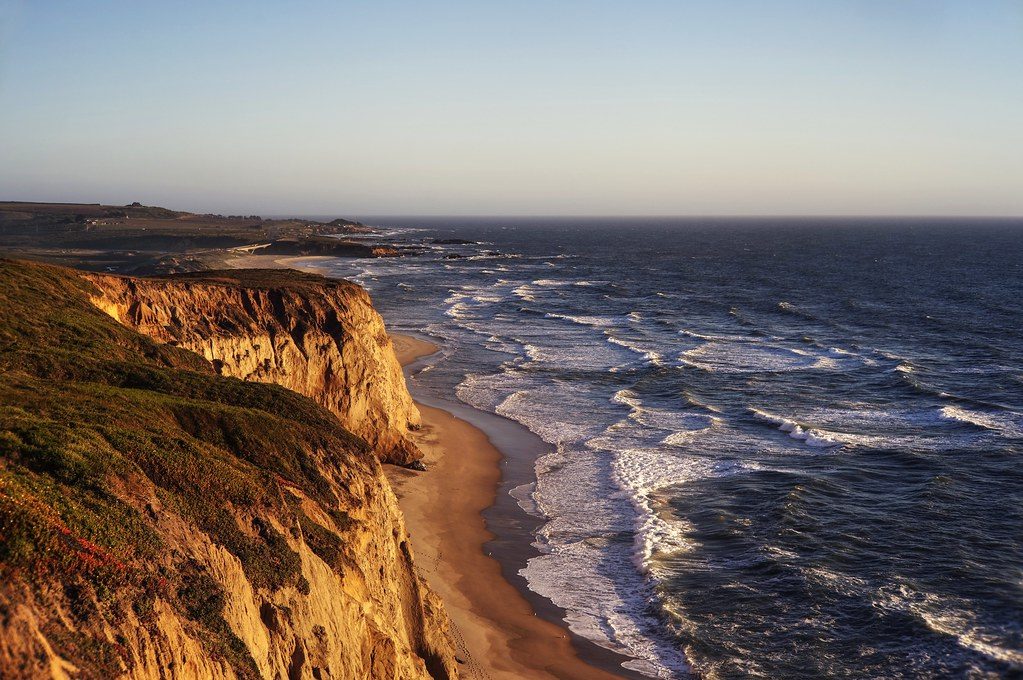 Wild Coast rugged coastline with traditional rondavels and ocean views showing affordable adventure destination